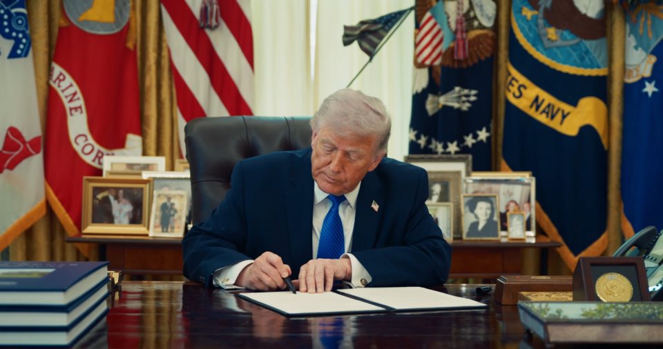 FILE PHOTO: President Donald Trump signs an executive order in the Oval Office, October 2026.